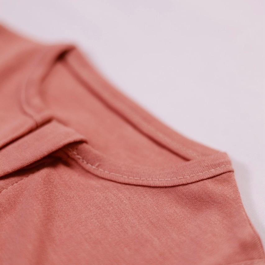 Close-up of a pink sleeveless top on a light background